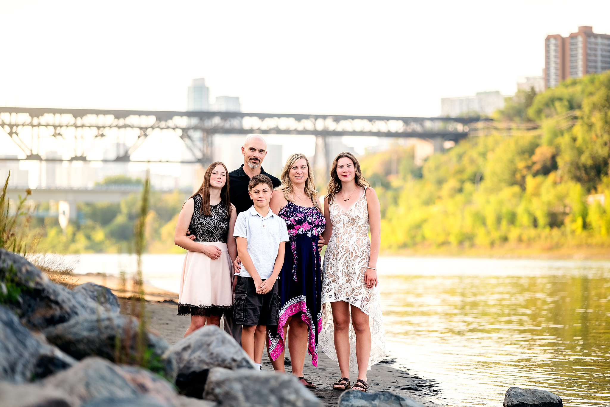 family standing near river highlevel bridge background edmonton downtown family photography