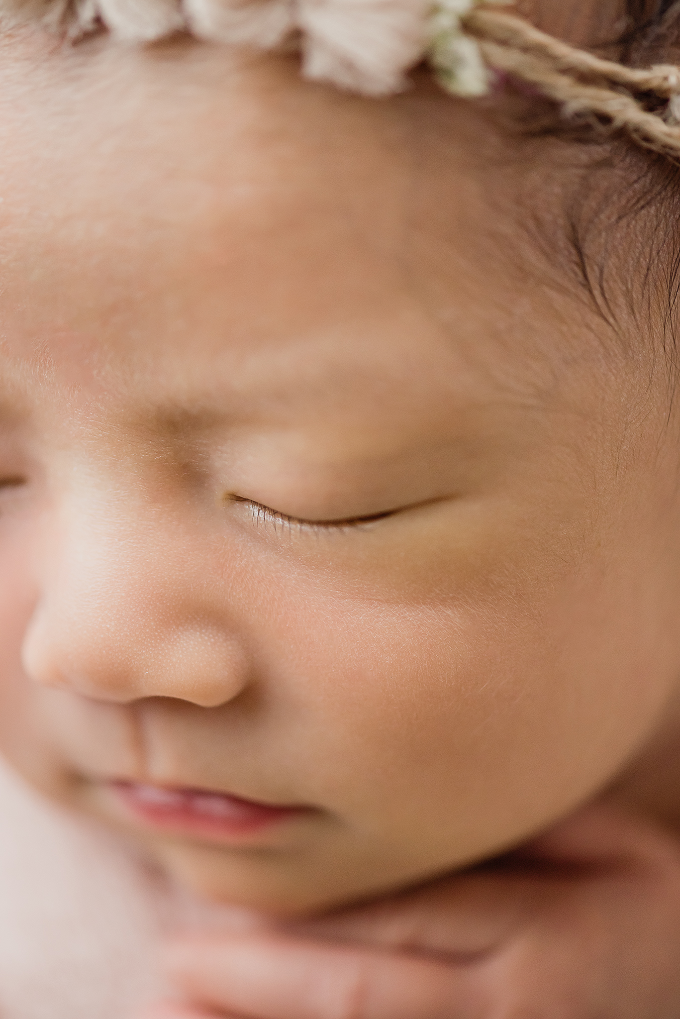 close up macro photo detail shot babys eyelashes face fills frame while baby sleeps in home posed newborn photography session edmonton alberta