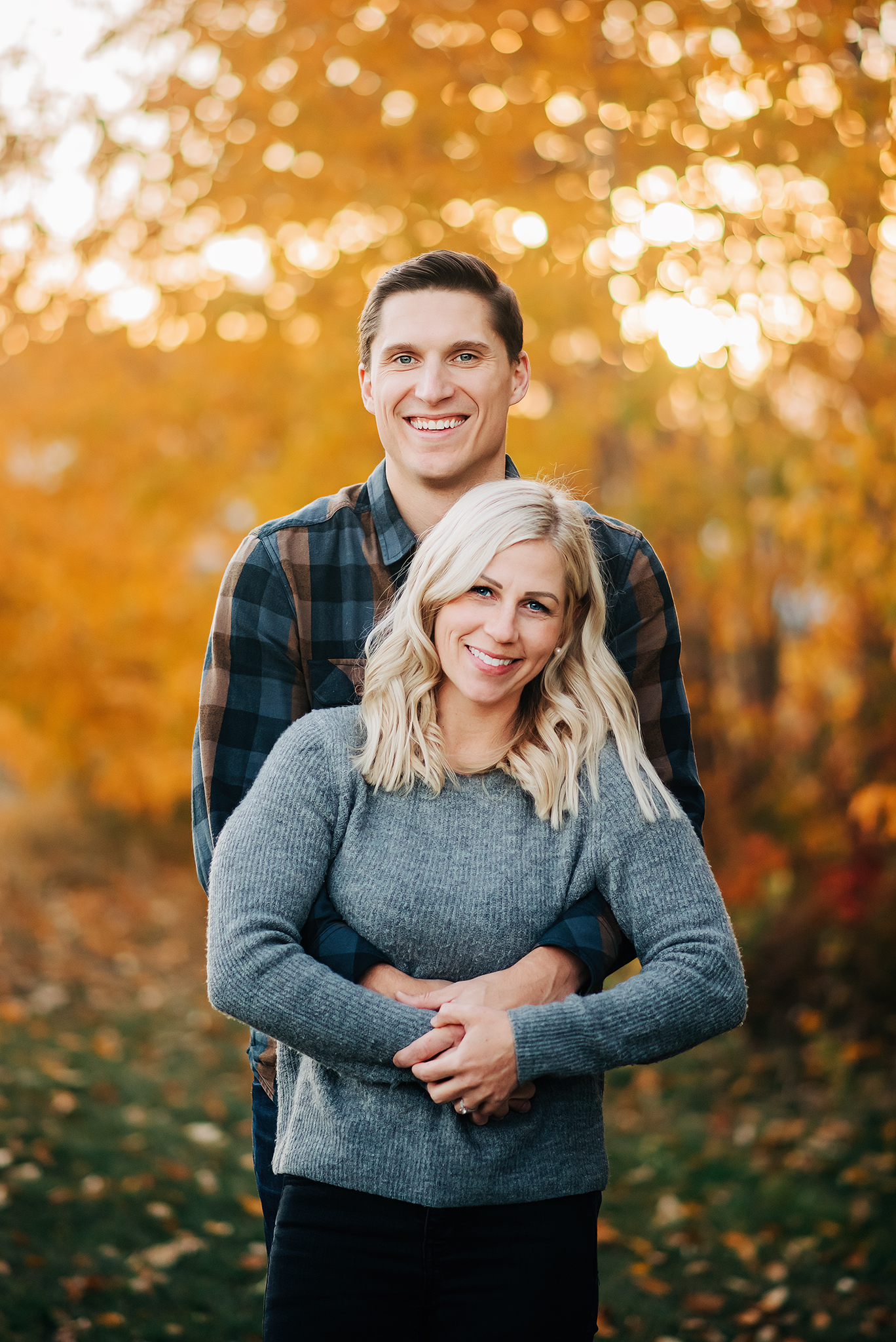 couple hugging fall colors family photo session yeg