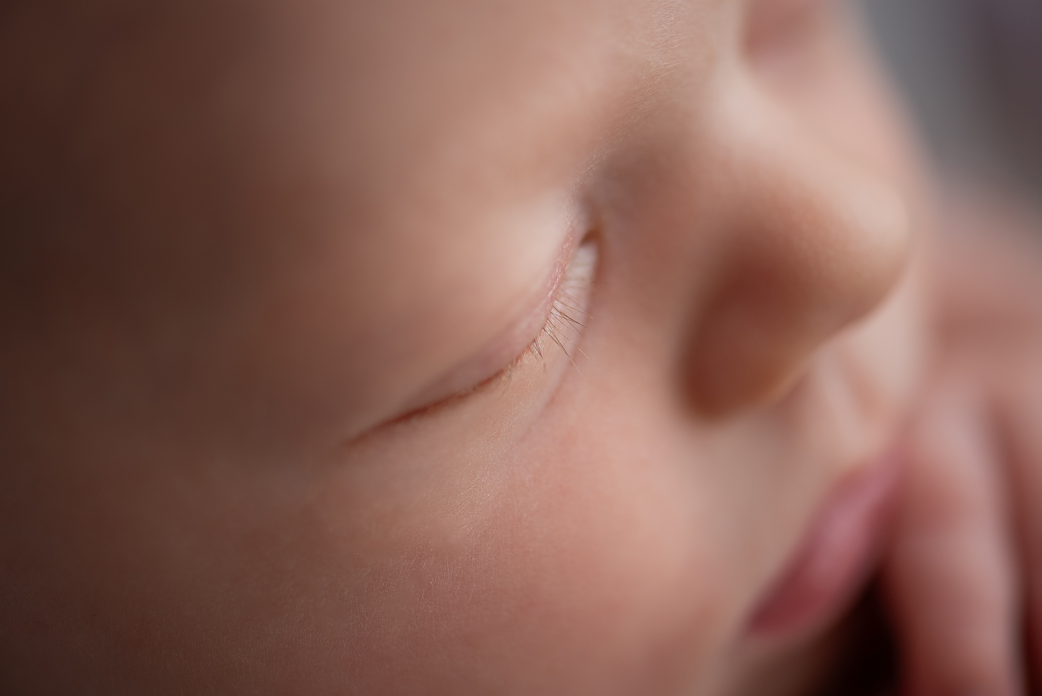 close up macro photo baby eyelashes in home posed newborn photographer strathcona county alberta
