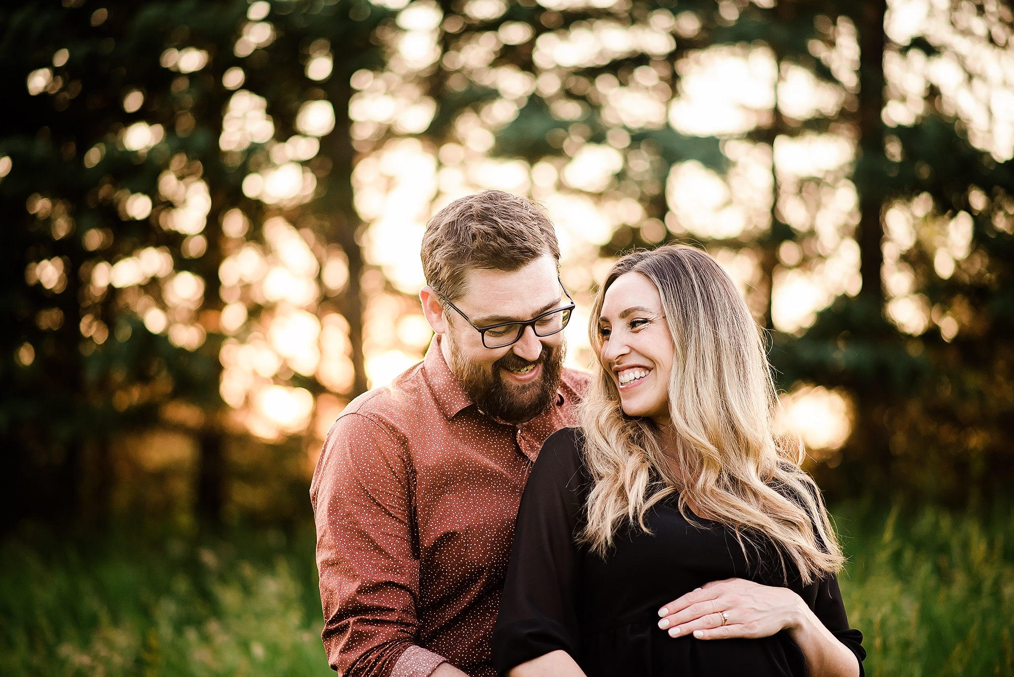 couples maternity session laughing together edmonton alberta