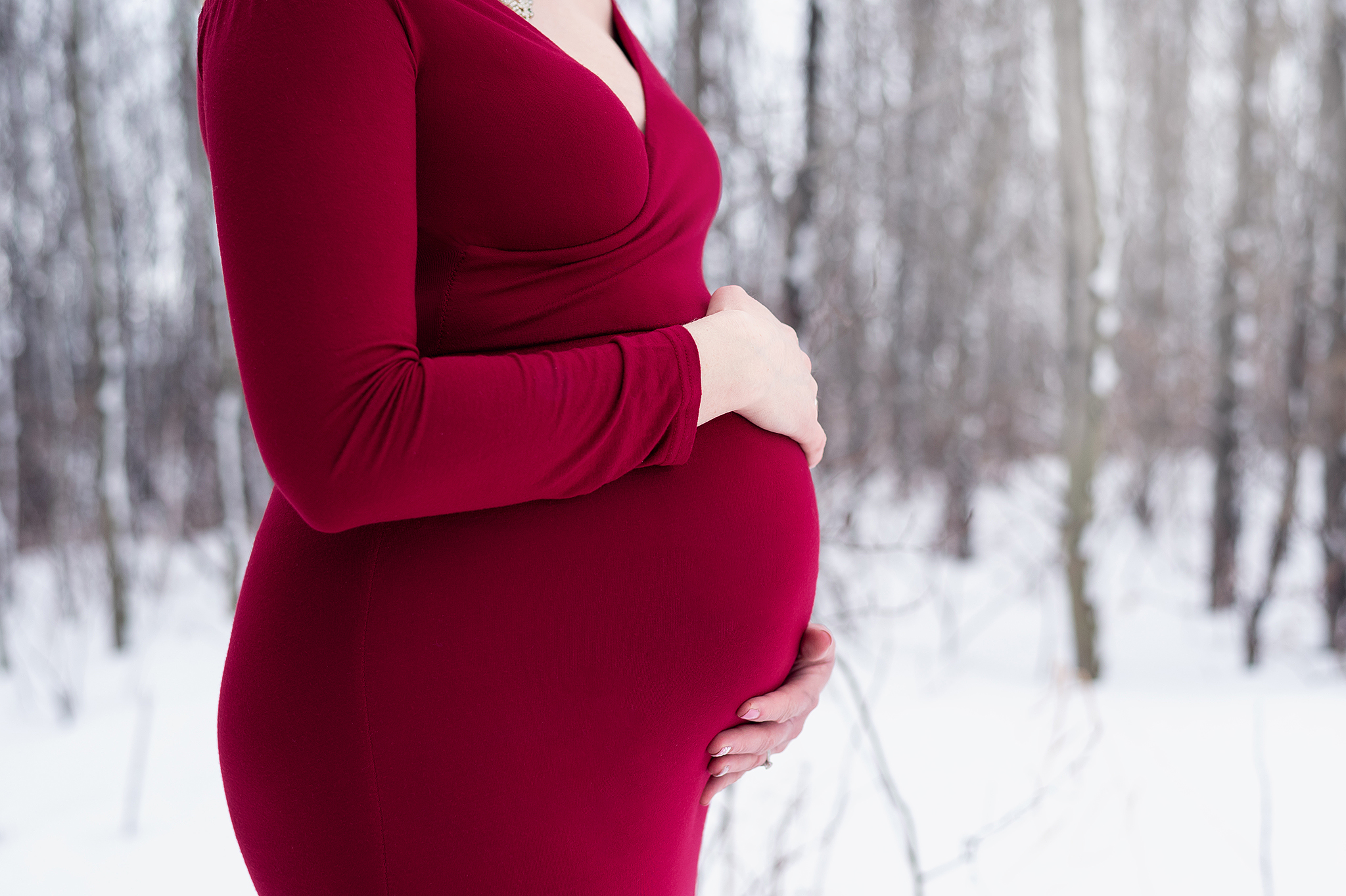 close up of pregnant belly outdoor maternity photographer alberta