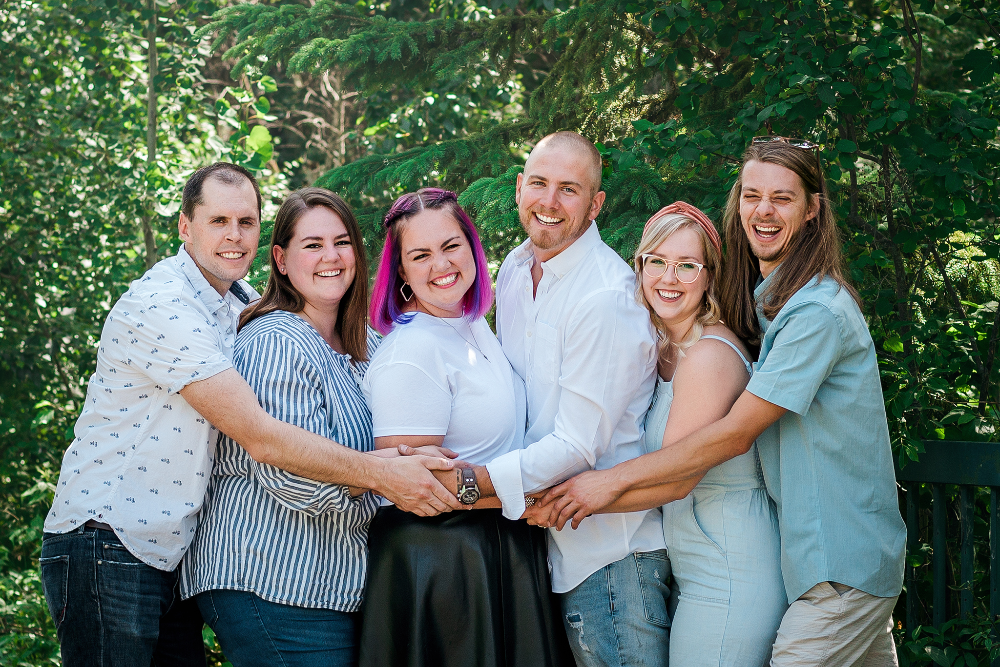grown sibling group hug edmonton river valley extended family photos